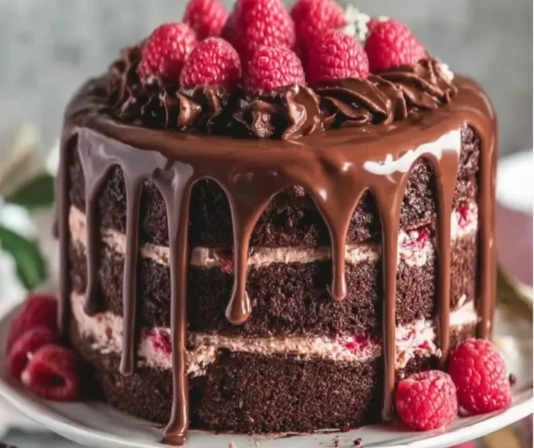 Decadent Raspberry Chocolate Layer Cake 2 Decadent raspberry chocolate layer cake with rich frosting and fresh raspberries
