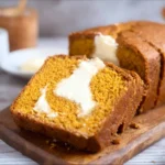 Keto Pumpkin Bread with Cream Cheese Filling served on a rustic plate