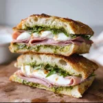 Mortadella, pesto, and burrata focaccia sandwich with garlic confit aioli